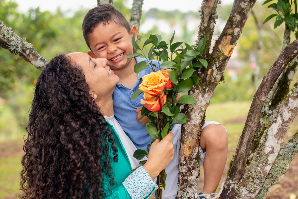 A mother and son picking flowers